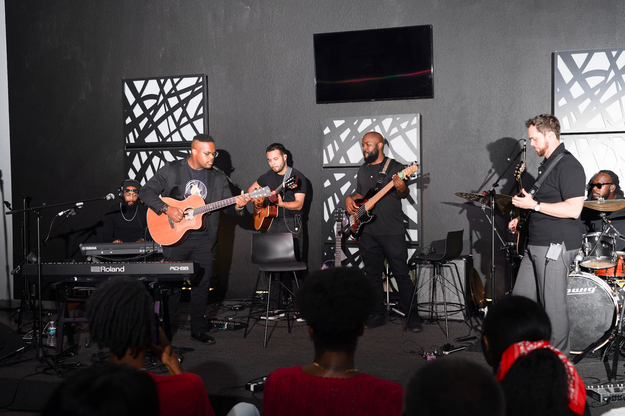 JKelly Music performing with a full band at an intimate acoustic showcase