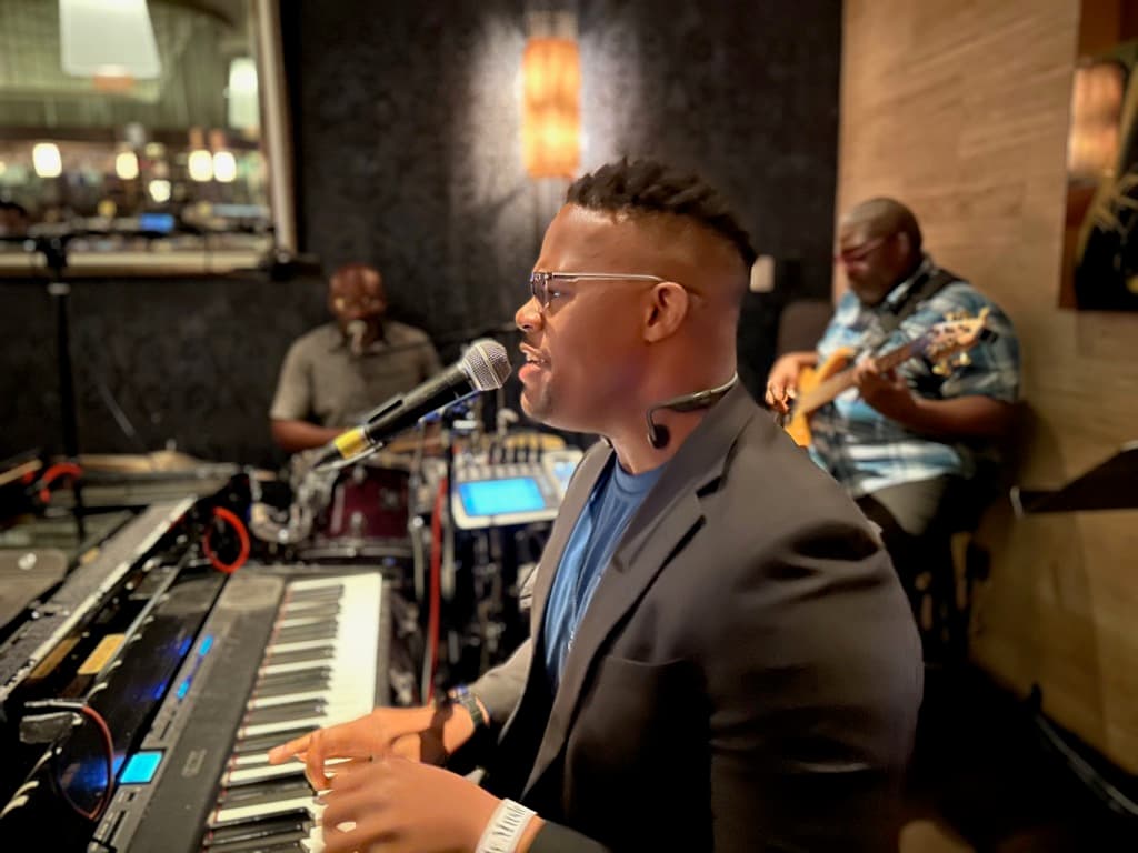 JKelly Music performing at keyboard with a live band
